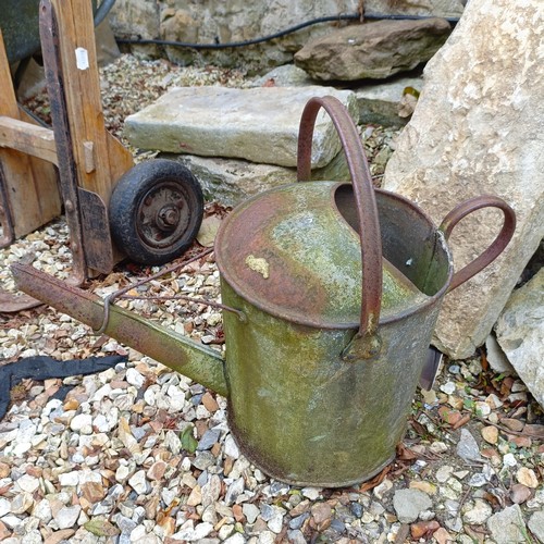 1073 - A painted wheelbarrow, another, assorted watering cans and a sack barrow