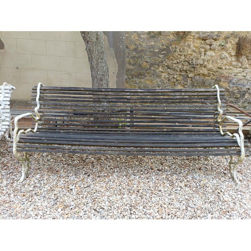 1071 - A pair of early 20th century country house garden benches, with wooden slats and painted metal crabs... 