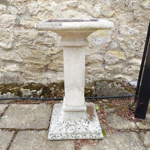 1080 - A composite stone pedestal, 81 cm high x 41 cm deep