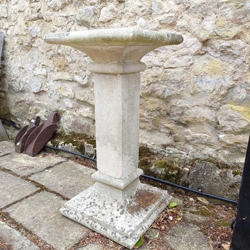 1080 - A composite stone pedestal, 81 cm high x 41 cm deep