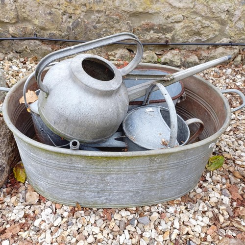 1073 - A painted wheelbarrow, another, assorted watering cans and a sack barrow