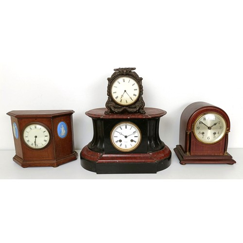 878 - A mantel clock, in a red marble and slate case, 33 cm wide, and three other clocks (4)