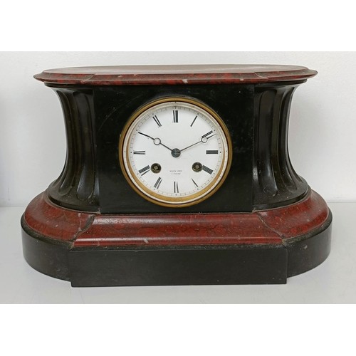 878 - A mantel clock, in a red marble and slate case, 33 cm wide, and three other clocks (4)