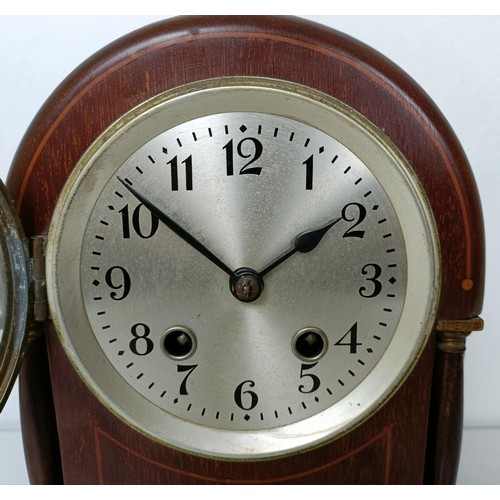 878 - A mantel clock, in a red marble and slate case, 33 cm wide, and three other clocks (4)