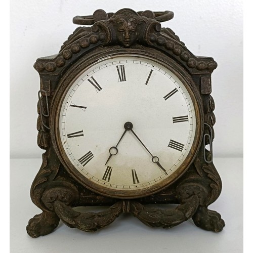 878 - A mantel clock, in a red marble and slate case, 33 cm wide, and three other clocks (4)