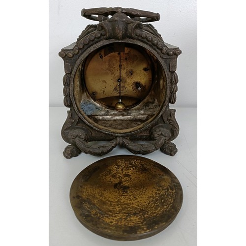 878 - A mantel clock, in a red marble and slate case, 33 cm wide, and three other clocks (4)