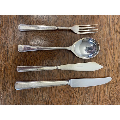 975 - A silver plated canteen of cutlery, settings for twelve, in an oak serpentine two drawer table, 97 c... 