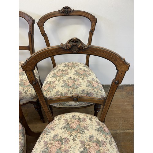 954 - A set of six walnut dining chairs (6)