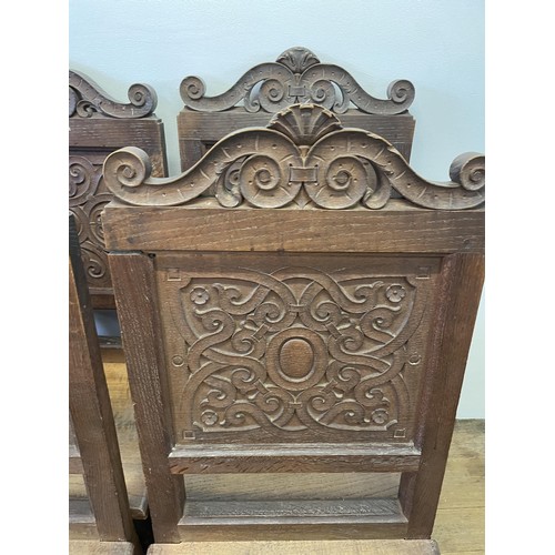 956 - A harlequin set of six oak dining chairs, with carved panel backs (6)