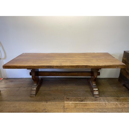 945 - An oak refectory dining table, the top 226 x 92 cm