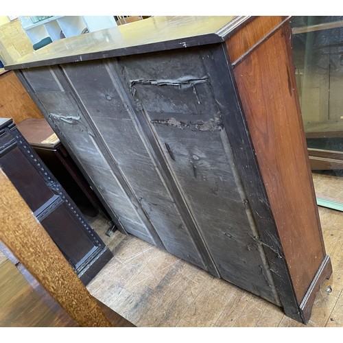 997 - A mahogany bookcase, with two glazed doors, 123 cm high x 135 wide