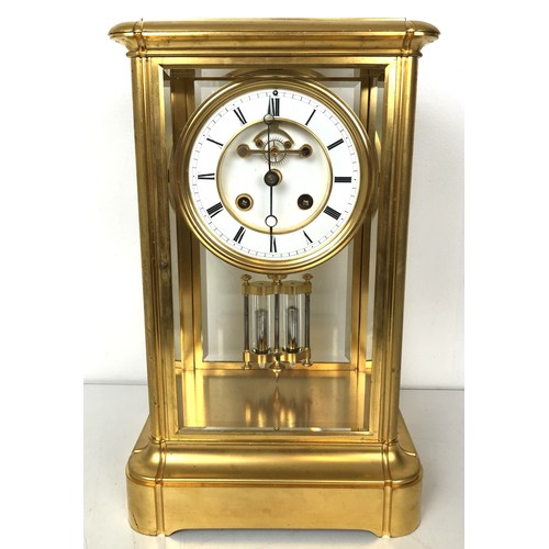 902 - A mantel clock, with an enamel dial, with a visible anchor escapement, to a twin train movement, str... 