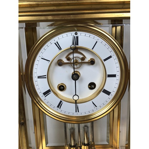 902 - A mantel clock, with an enamel dial, with a visible anchor escapement, to a twin train movement, str... 