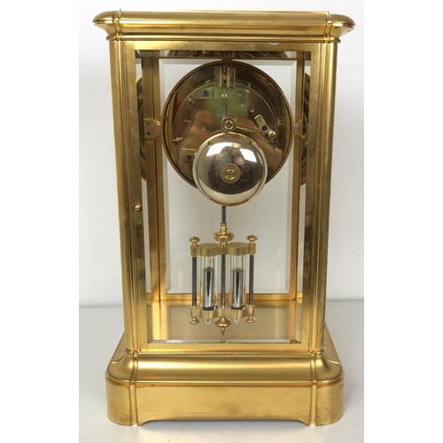 902 - A mantel clock, with an enamel dial, with a visible anchor escapement, to a twin train movement, str... 