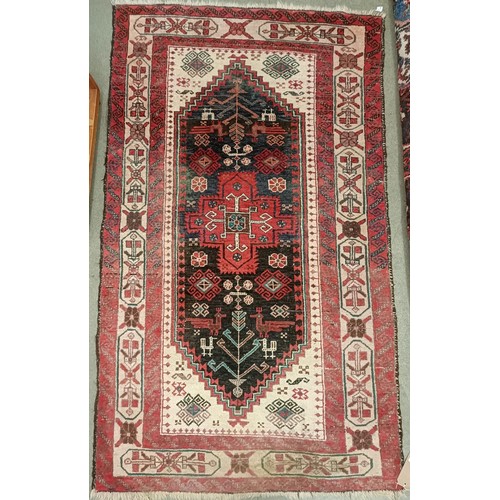 1085 - A red ground rug, 188 x 108 cm