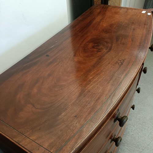 1057 - A mahogany bow front chest, having two short and three long drawers, 127 cm wide