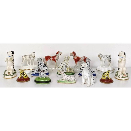 672 - A pair of Staffordshire figures of a dalmatian and a pup, 7 cm high, and assorted other Staffordshir... 