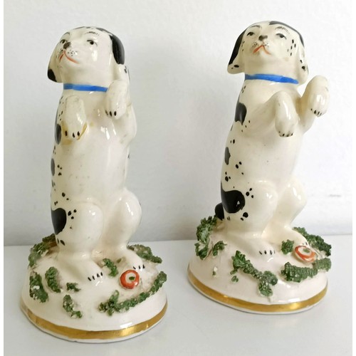 672 - A pair of Staffordshire figures of a dalmatian and a pup, 7 cm high, and assorted other Staffordshir... 