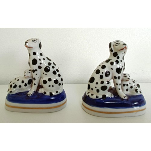 672 - A pair of Staffordshire figures of a dalmatian and a pup, 7 cm high, and assorted other Staffordshir... 