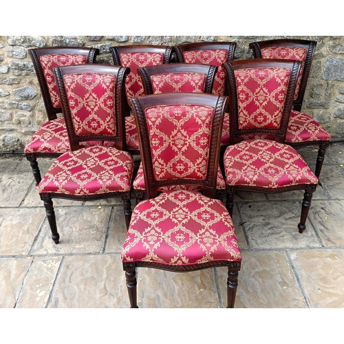 947 - A set of eight mahogany framed dining chairs with padded backs and seats