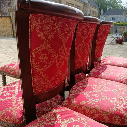 947 - A set of eight mahogany framed dining chairs with padded backs and seats