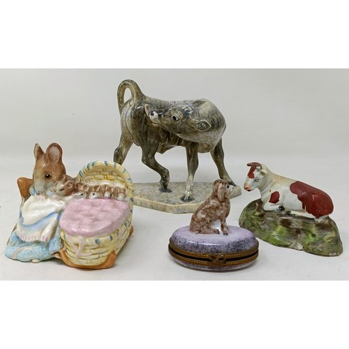 681 - A Limoges novelty box, with a dog finial, two figures of cows, and a Beswick figure