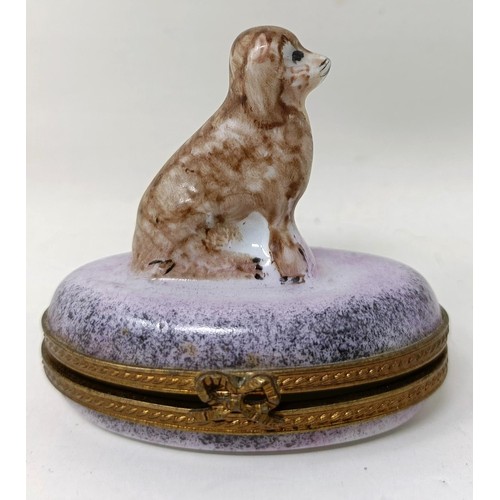 681 - A Limoges novelty box, with a dog finial, two figures of cows, and a Beswick figure