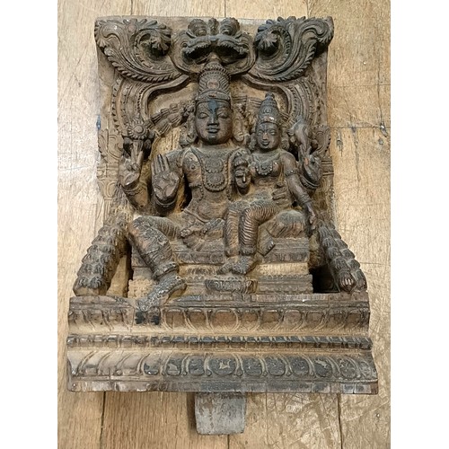 684 - A carved wooden temple carving, decorated two figures, 41 x 28 cm