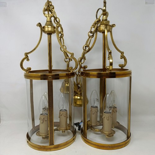 1086 - A pair of brass and glass wall lights, 50 cm high