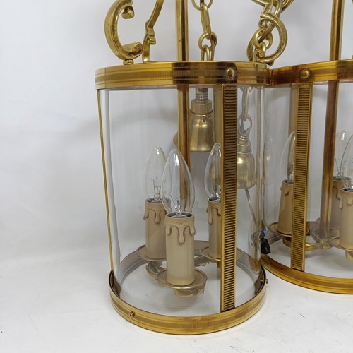 1086 - A pair of brass and glass wall lights, 50 cm high