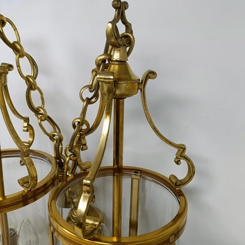 1086 - A pair of brass and glass wall lights, 50 cm high