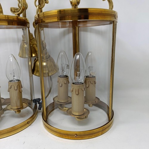 1086 - A pair of brass and glass wall lights, 50 cm high