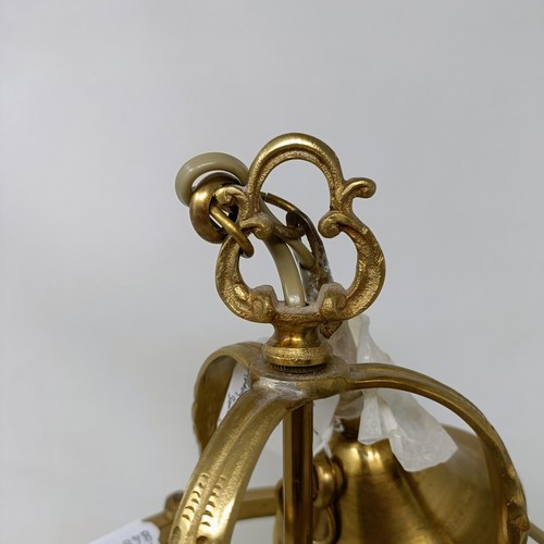 1087 - A brass and glass wall light, 44 cm high