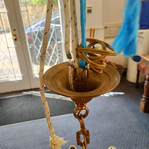 1088 - A brass chandelier, with cut glass drops, 50 cm diameter approx.