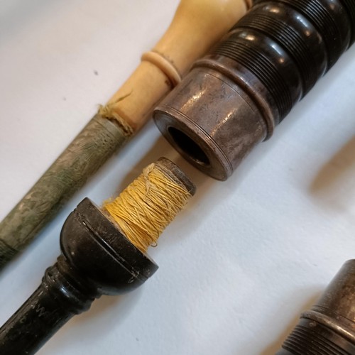 532 - A set of pipes with ivory and silver coloured metal mounts, for a bagpipe, in an associated wooden b... 