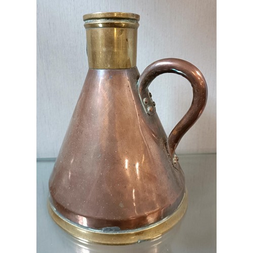 8 - A Shell Mex Quart copper and brass measure, of conical form, numbered 125, 19.5 cm high and an assoc... 