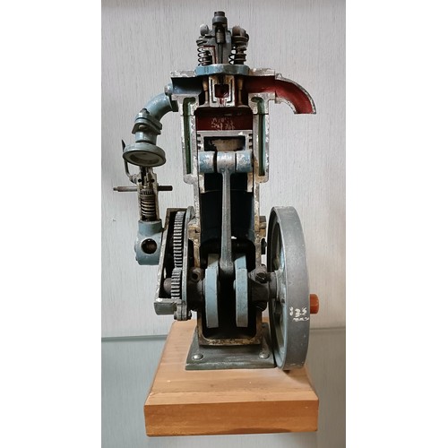 6 - A cut away model of a stationary engine, on a wooden base, 33.5 cm high (overall)