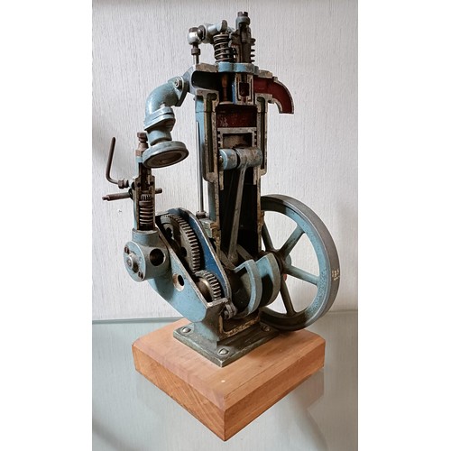 6 - A cut away model of a stationary engine, on a wooden base, 33.5 cm high (overall)