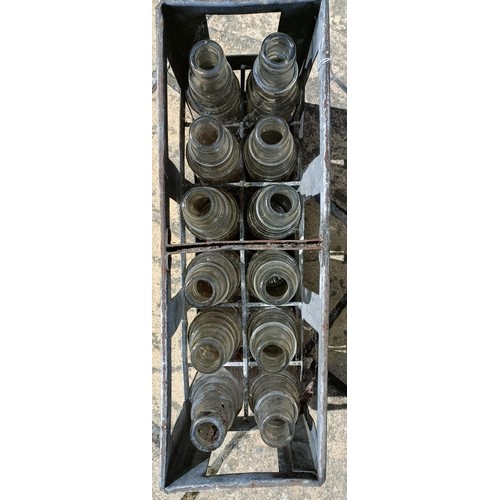 127 - A metal forecourt oil bottle crate, with twelve glass bottles