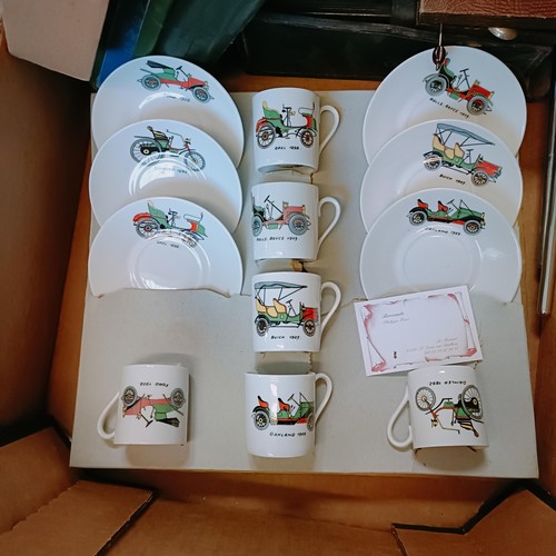 42 - A Limoges coffee set, each piece decorated a veteran car, a car mascot, in the form of a winged lady... 