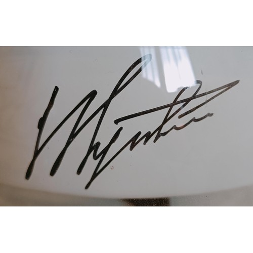 41 - A marshalls helmet, signed by Agostini for the owner, with a photo of the helmet being signed