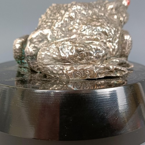 384 - A C Paillet Toad mascot, with nickel plated finish, signed Ch. Paillet and dated 1919, with red glas... 