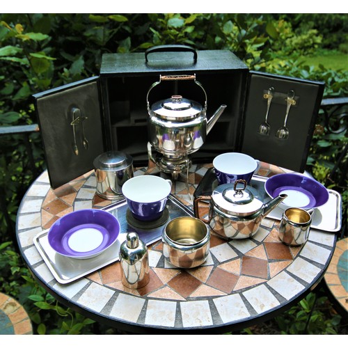 421 - A fine Edwardian 1909 travelling picnic tea set, designed by the legendary Dr. Christopher Dresser, ... 