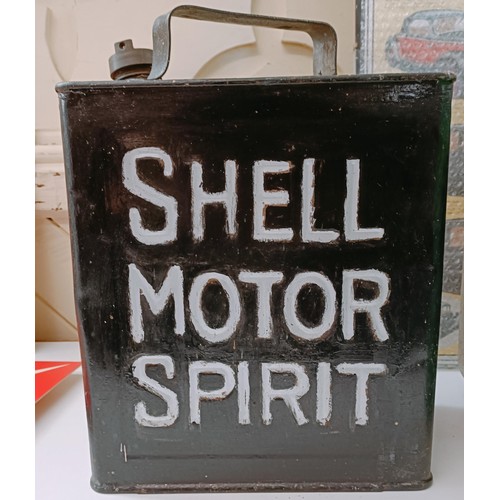 236 - A Shell Motor Spirit oil can, two other oil cans, two Citroen clocks, and a group of pictures