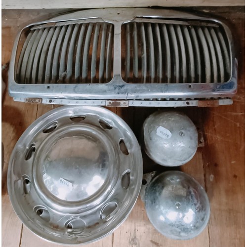 263 - Two Ford Escort Mk 1 grills, and other trim parts (qty)