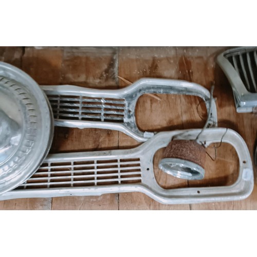 263 - Two Ford Escort Mk 1 grills, and other trim parts (qty)