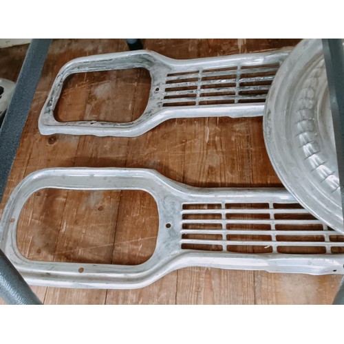 263 - Two Ford Escort Mk 1 grills, and other trim parts (qty)