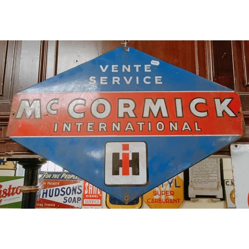 294 - An enamel sign, McCormick International Vente Service, 80.5 cm wide Provenance: From the estate of t... 