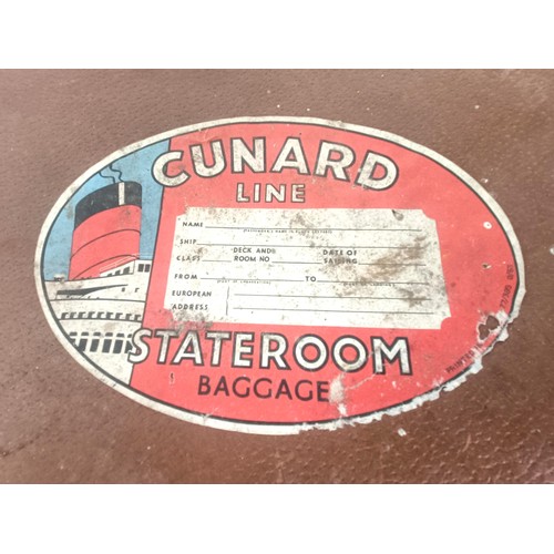 422 - A vintage suitcase, with Cunard Line Stateroom Baggage label, and contents, with assorted motoring a... 