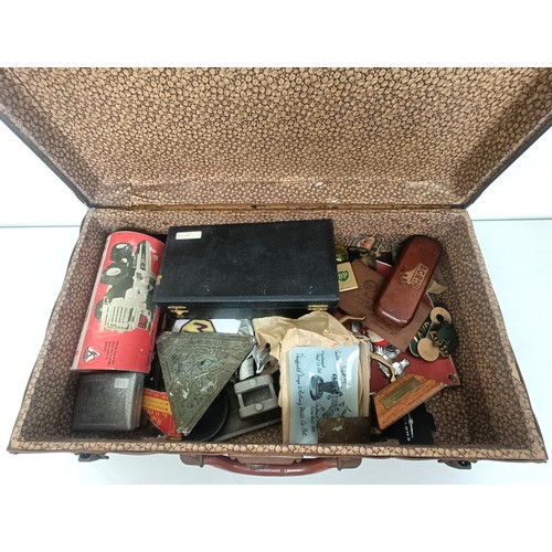 422 - A vintage suitcase, with Cunard Line Stateroom Baggage label, and contents, with assorted motoring a... 